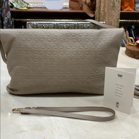 ANYA HINDMARCH LEATHER SIGNATURE EMBOSSED BOWS CROSSBODY BAG IN TAUPE - Picture 8 of 14